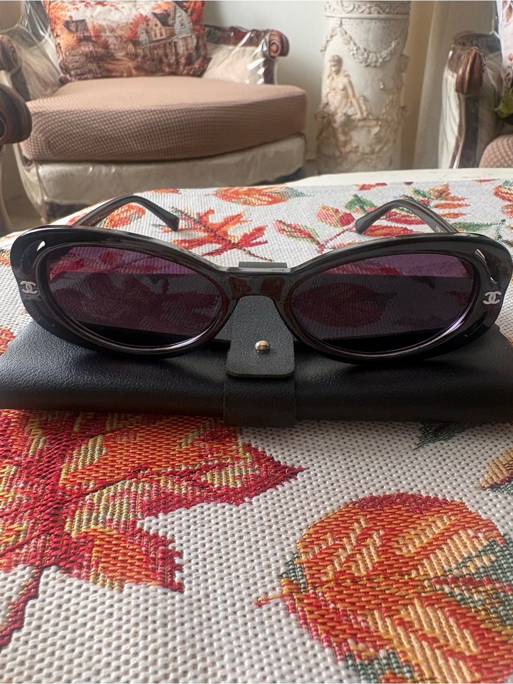 CHANEL Black Frame Sunglasses with Purple Lenses